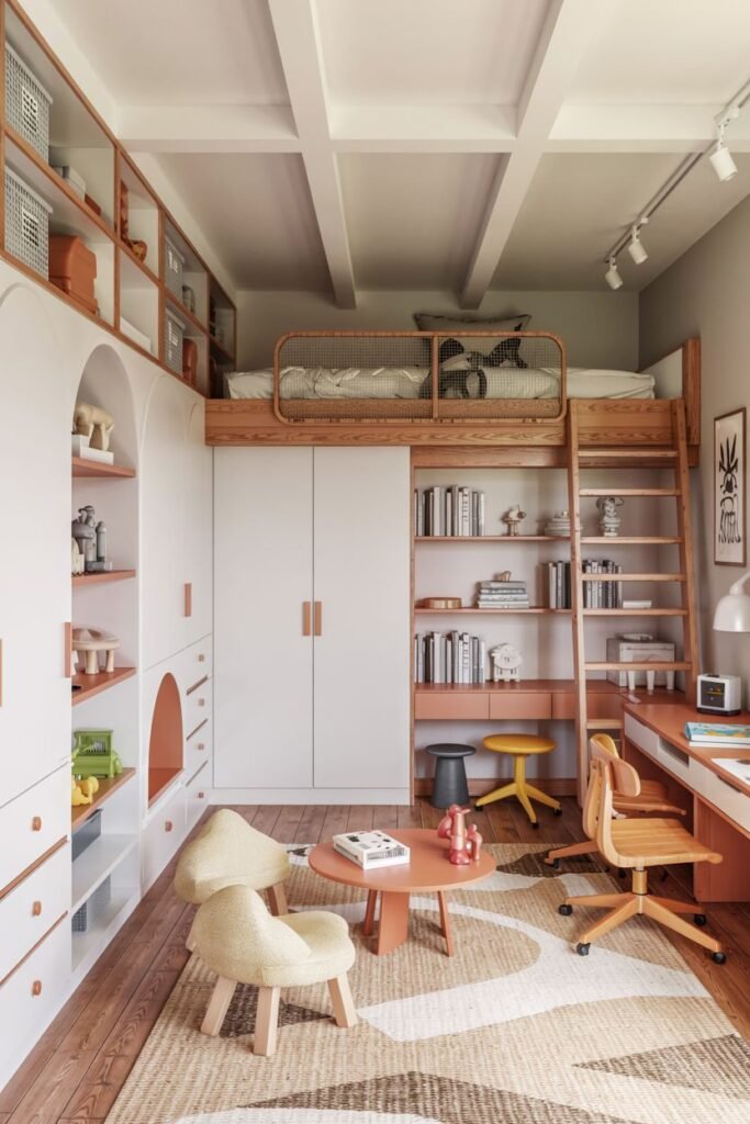 Chic kids' bedroom featuring a loft bed accessed by a ladder, a lower area with a desk and bookshelves, and a small seating area with a table and chairs on a geometric rug.
