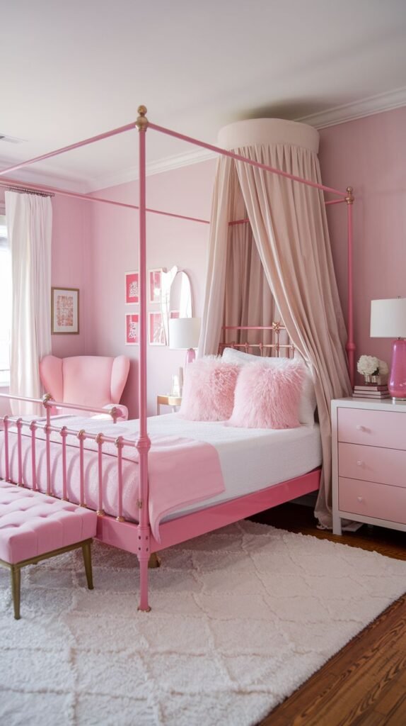 A luxurious and amazing and comfy all-pink bedroom featuring a pink four-poster canopy bed with plush pink furry pillows and elegant drapes. A matching pink padded bench sits at the foot of the bed, and a white dresser with pink drawers completes this elaborately themed space, all on a soft white rug.