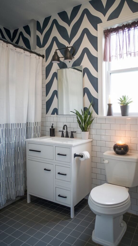 A small, modern bathroom featuring a bold blue and white wavy accent wall. It combines white subway tiles, a white vanity with black fixtures, a toilet, and a shower with a striped curtain.