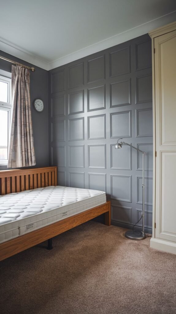 A sophisticated bedroom is enhanced by dark grey square wall paneling, providing a strong visual statement and depth, an excellent application for PVC.