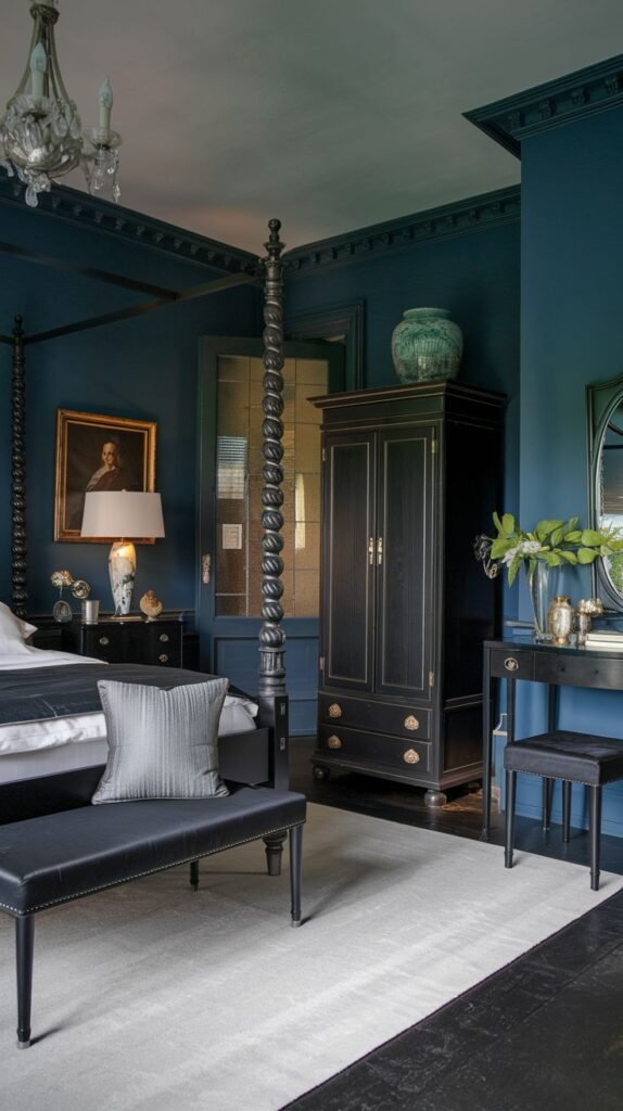 A sophisticated and dramatic bedroom, offering redecorating inspiration with deep blue walls, an elaborately carved black four-poster bed, a vintage-style wardrobe, and a contrasting white rug.