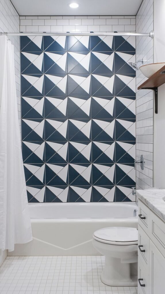 Luxury bathroom shower accent wall covered in a high-contrast geometric pattern of navy blue and white triangular tiles.