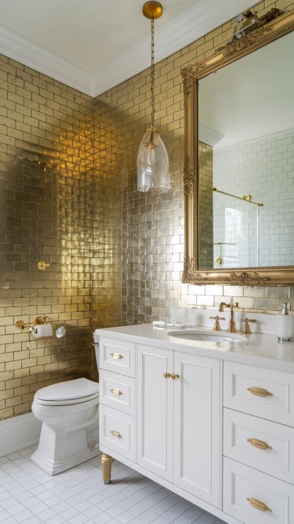 Vibrant luxury powder room accent wall entirely clad in shimmering, reflective metallic gold subway tiles, paired with a white vanity and ornate gold mirror.