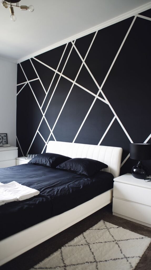 A contemporary black accent wall painted with thin white lines creating an abstract, fractured geometric design that intersects irregularly.