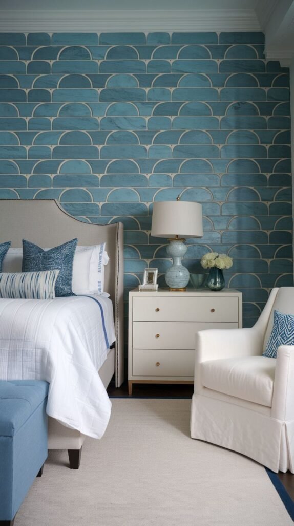 Mid-Tone Blue Scalloped Tile Pattern Wall Bedroom featuring an accent wall covered in a repeating pattern of mid-tone blue scallop-shaped tiles or half-moons, outlined in a lighter color.