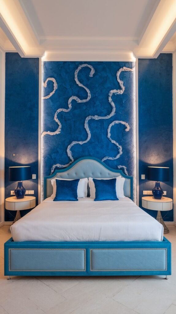 Venetian Plaster Blue Accent with Illuminated White Serpentine Design Accent wall in a rich, textured blue finish, illuminated from above, featuring dramatic, flowing white serpentine lines as a central design element.