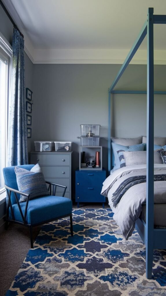 Monochromatic blue Cozy Small Bedroom For Men with a blue-painted four-poster bed frame, a matching blue dresser, and a bold geometric blue area rug.