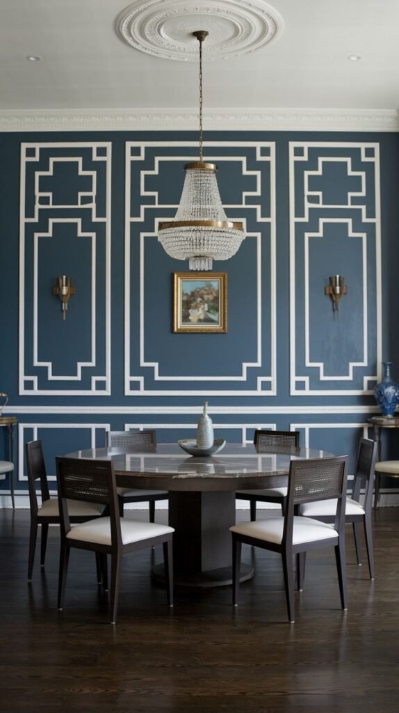 A highly detailed accent wall painted deep blue, decorated with intricate white molding applied in elaborate, interlocking neoclassical geometric patterns.