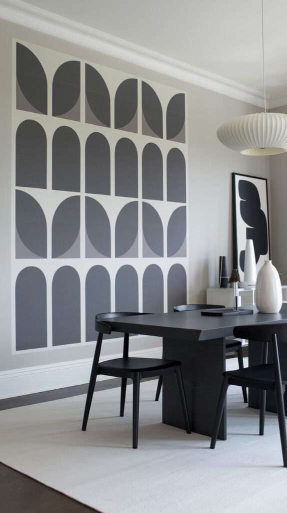 A modern accent wall featuring a large graphic mural with repeating vertical columns of geometric arches and half-circles in white, light gray, and darker gray.