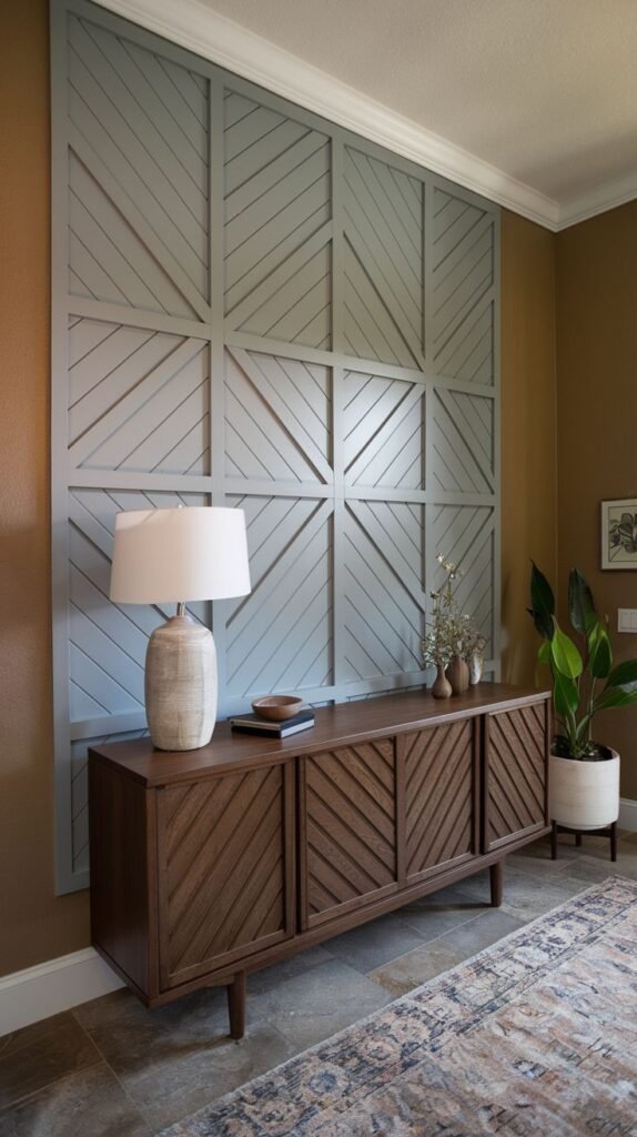 Large accent wall paneled in a light gray-blue color, divided into nine squares, where the internal diagonal wood slats create a chevron or radiating pattern.