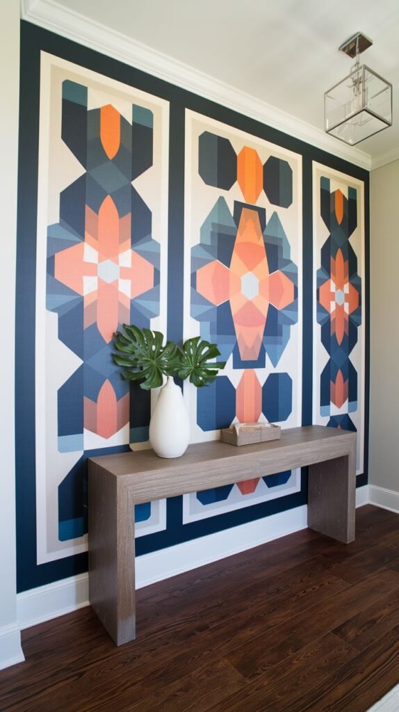 Entryway accent wall featuring three tall vertical panels filled with bold, colorful geometric designs in blue, orange, and white, framed by dark navy trim.