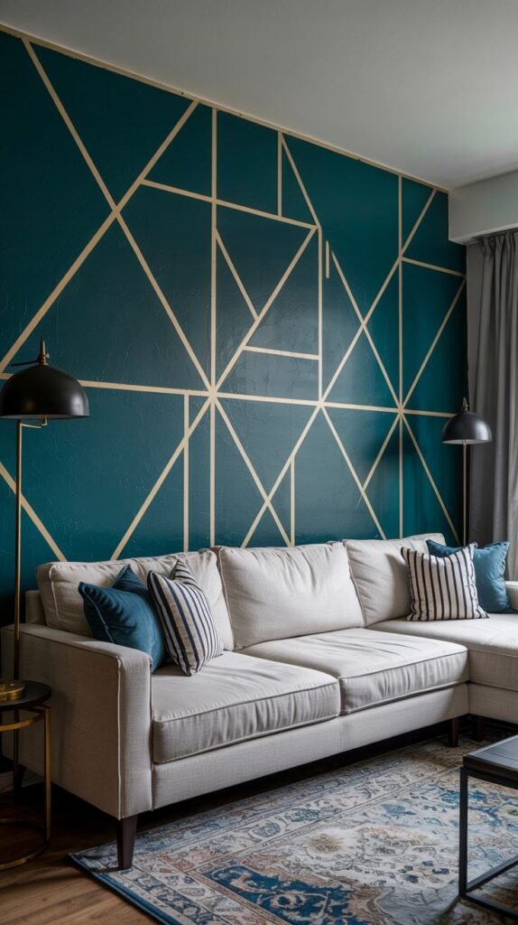 Bold geometric feature wall painted in a deep teal or dark blue, decorated with thin, intersecting light gold lines creating an abstract linear pattern.