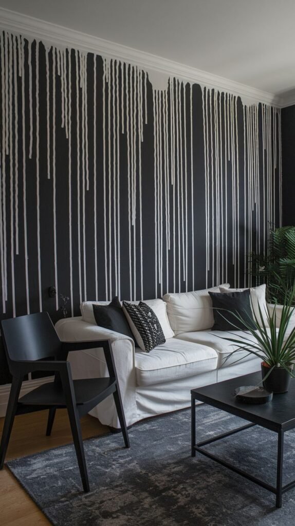 Black accent wall featuring vertical white abstract lines extending down from the ceiling crown molding, creating a high-contrast paint drip effect.