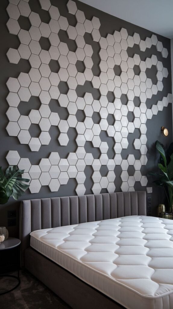 A dark gray accent wall decorated with an abstract scatter of protruding, three-dimensional white hexagonal tiles.