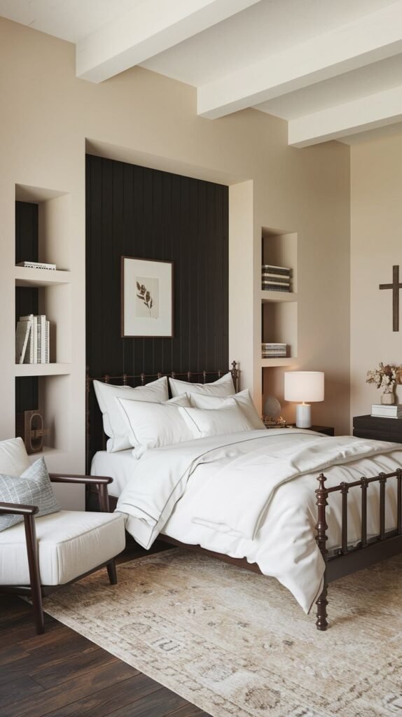 Bedroom featuring a dark, vertically paneled accent wall behind a dark metal bed, flanked by built-in recessed shelving niches, contrasting with light beige walls and white ceiling beams.