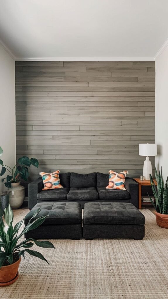 A minimalist space featuring a center accent wall of horizontal, light gray-washed shiplap, flanked by white walls.
